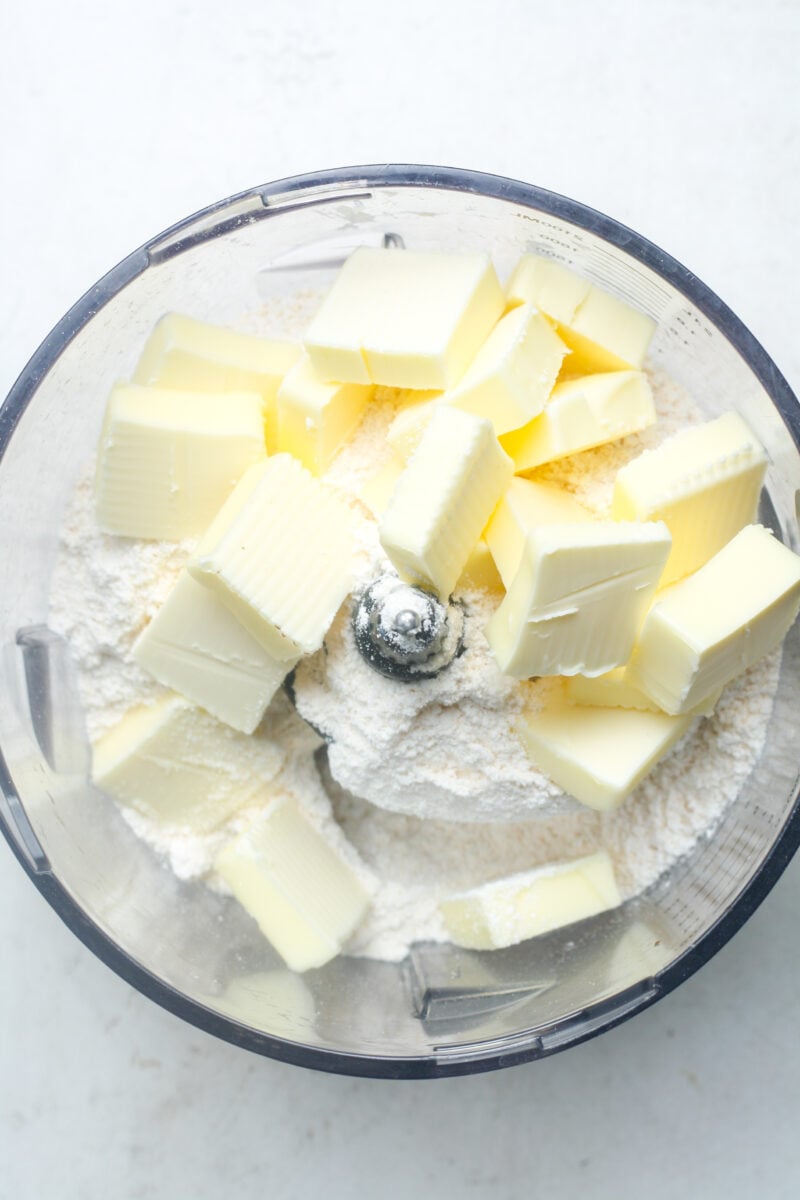 Butter cubes in food processor.