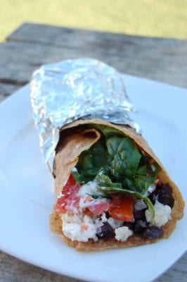 Pork, rice, black bean, and spinach burritos wrapped in whole-wheat tortillas.