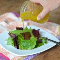 Mustard Vinaigrette dressing poured over salad