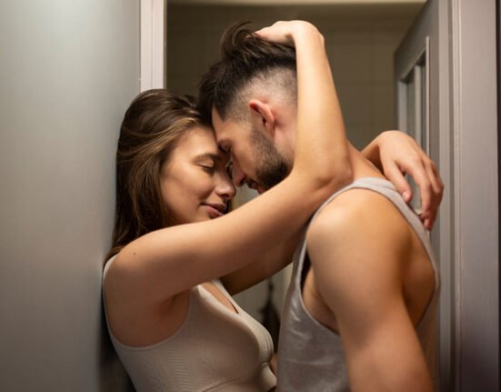 A boy and Girl standing in intimate pose