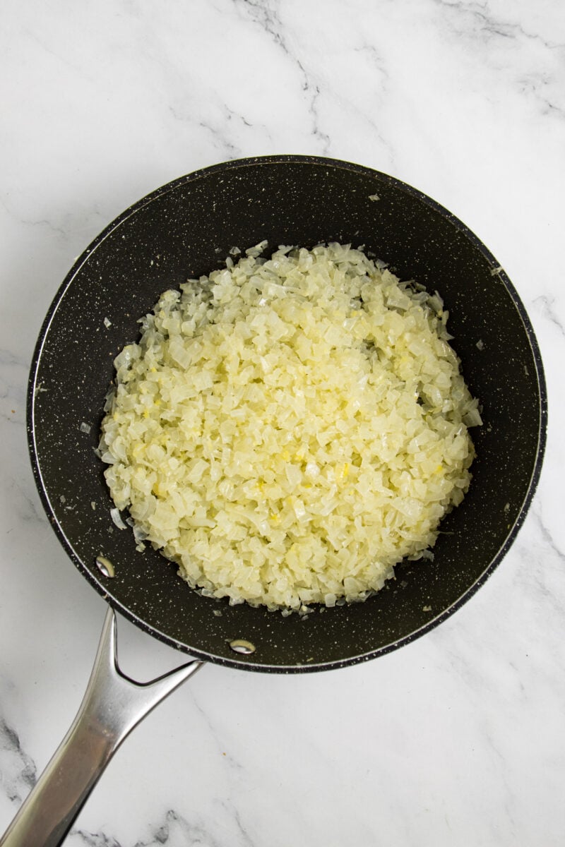 Finely diced onions in pan.