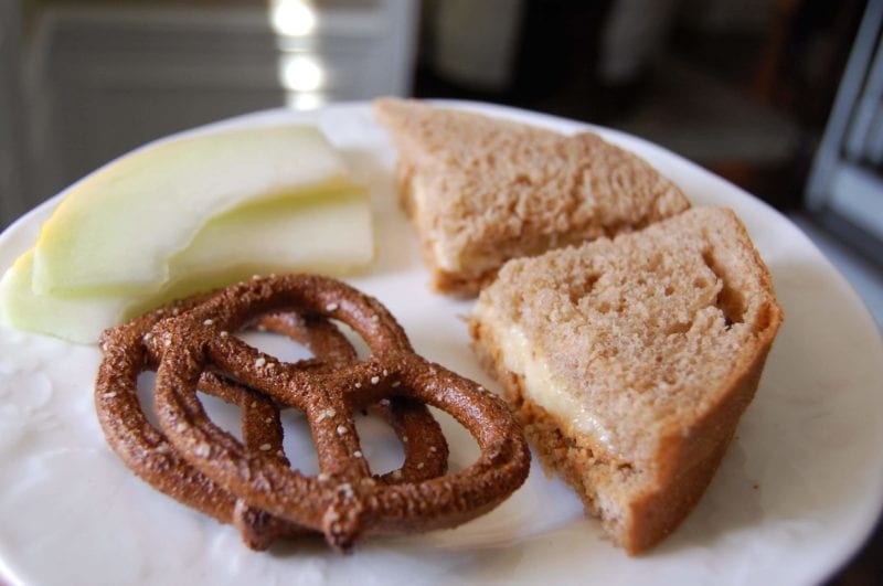 Peanut butter and banana (instead of jelly) sandwich, whole-wheat pretzels, and fruit.