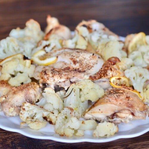 roasted chicken and cauliflower dinner on a white plate